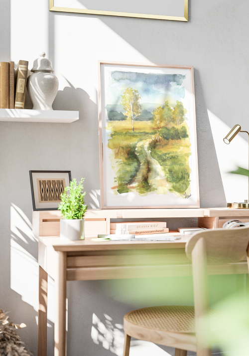 Nad biurkiem stoi obraz ilustrujący pejzaż malowany akwarelą, autorka Agnieszka kierat stadnik